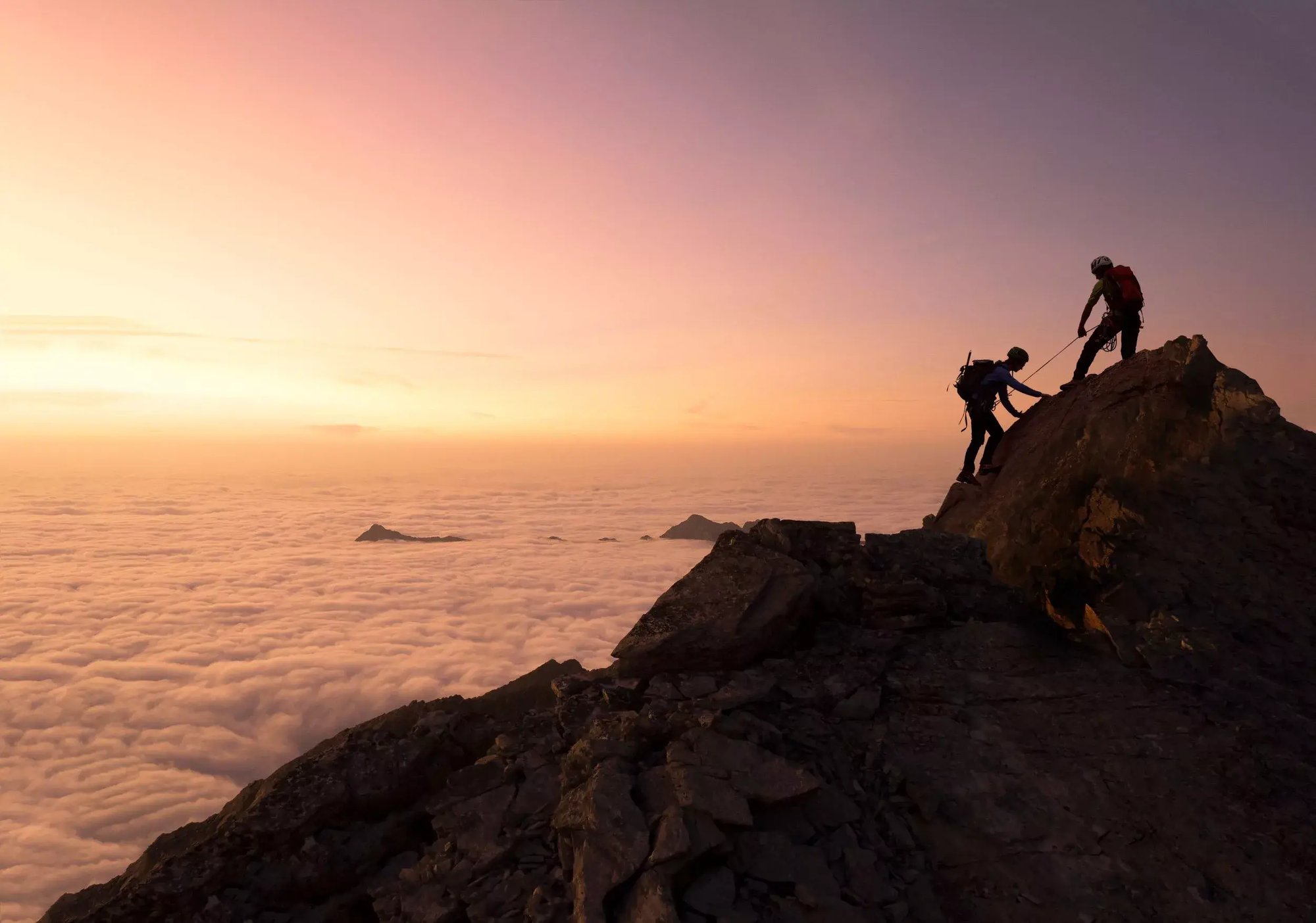helping-each-other-climbing-mountain-GettyImages-860770930-2500-webp